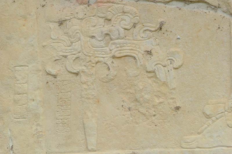 Detail of Bonampak Stela 1 showing the artist's signature glyphs carved near the staff tip