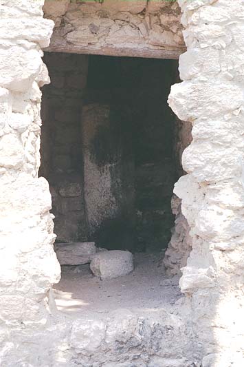Interior chamber of Structure XIII showing an altar-like masonry feature