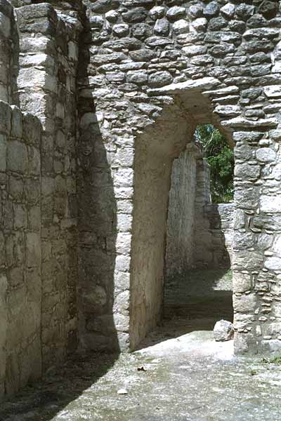 Narrow stone passageway within the residential apartments of Structure XIII