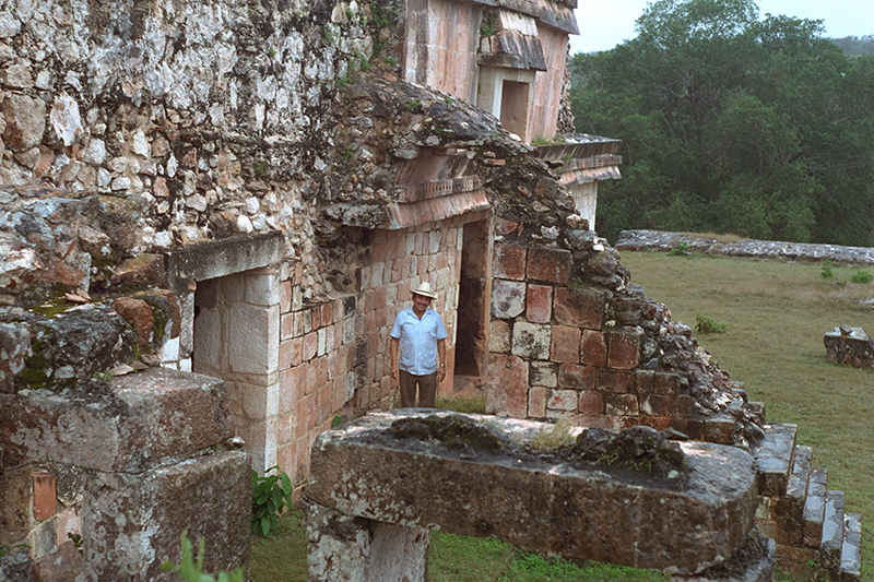 Manuel standing under the arch of the Palace staircase