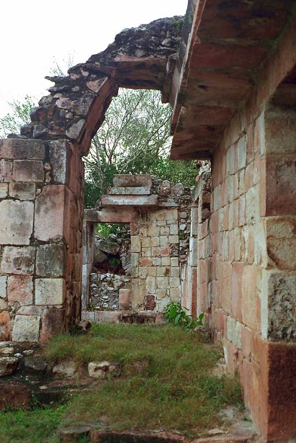View through the stairway arch toward the ruined western extension