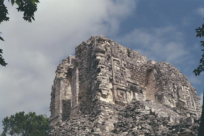 Chicanná, Structure XX upper temple showing fallen serpent-mouth motif and stacked rain god masks