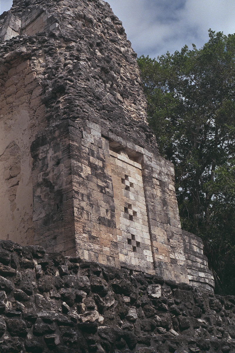 Decorative cross motifs typical of Rio Bec style masonry on the side of the South Tower