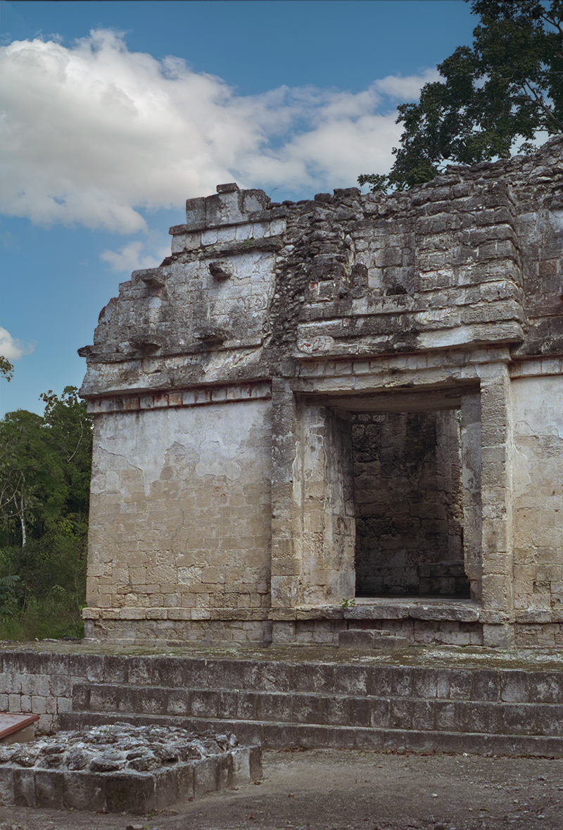 Vertical view of Structure II wing doorway, framed by a thatched Maya hut motif