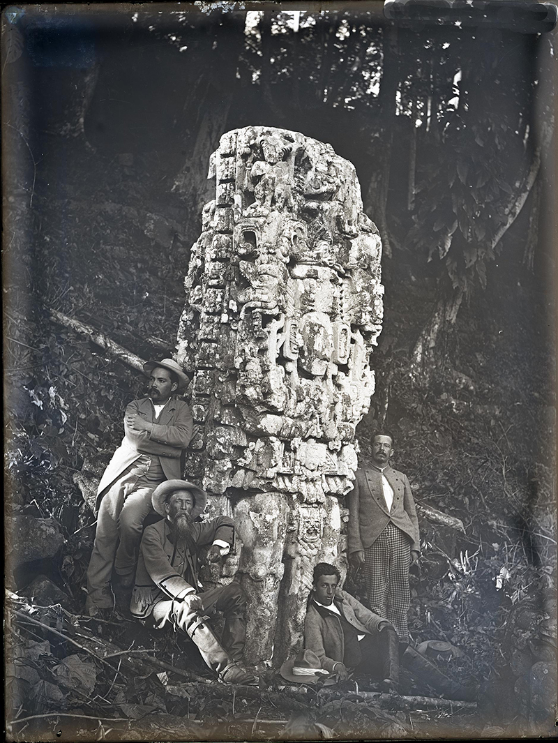 Maudslay's 1890-91 photo of  Stela N with a group of visiting local dignitaries