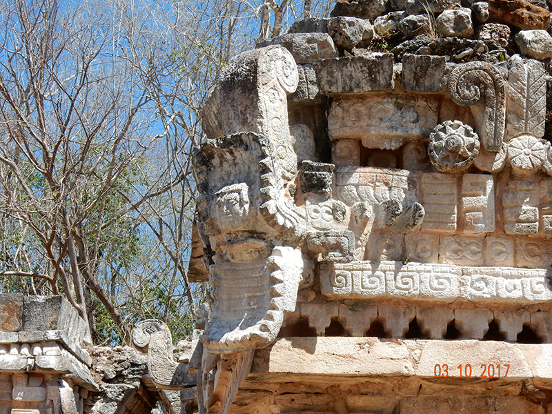 Detailed closeup of the human face inside the serpent maw on Room 18 of the Labna Palace