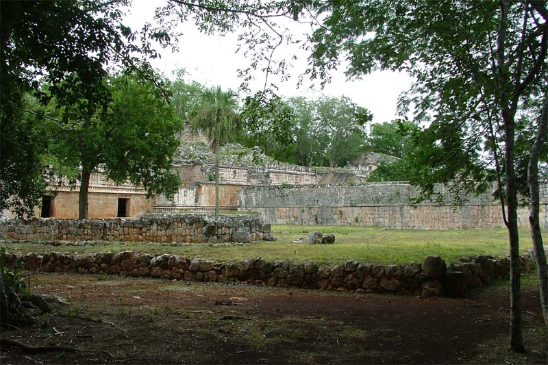 Archaeological photo of the featureless rear wall defining the east side of the west patio at Labna