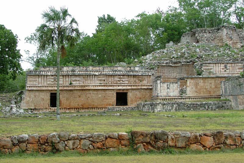 Wide view of the West Patio of the Palace at Labna, showing the low structures and enclosed functional areas