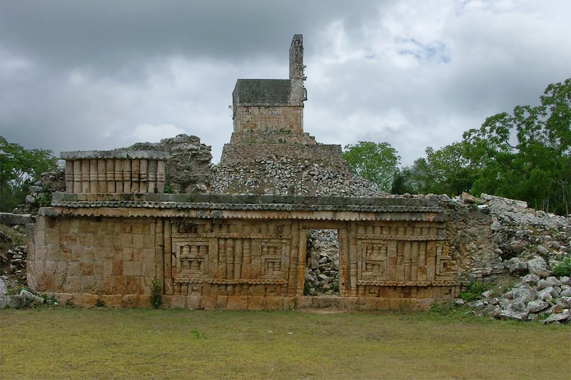 Detail of a surviving wall with Puuc decoration near the Arch