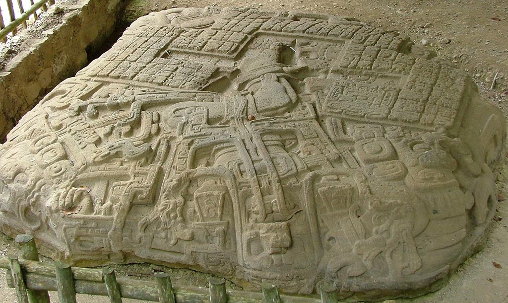 Altar P (Monument 24) showing Chac bursting from a crevice