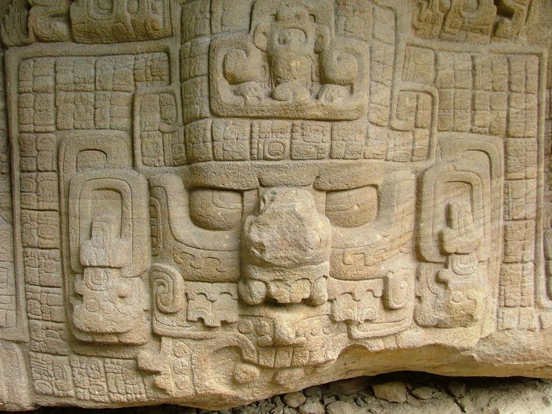 Close up of Zoomorph P monster carving and text