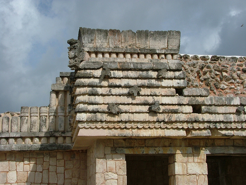 The frieze of the House of the Birds showing feather and crescent moldings with birds and feathers decorating the upper facade